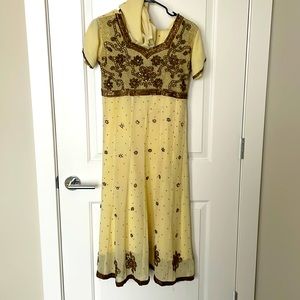 Cream color salwar kameez with beading work.